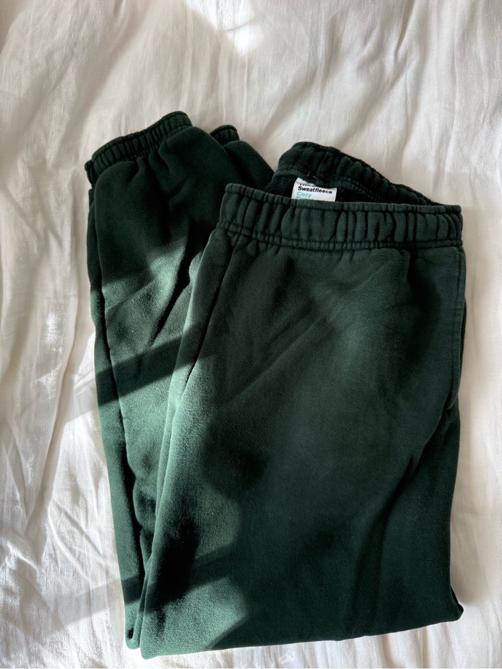 Aritzia TNA low rise mega fit joggers in scarab green